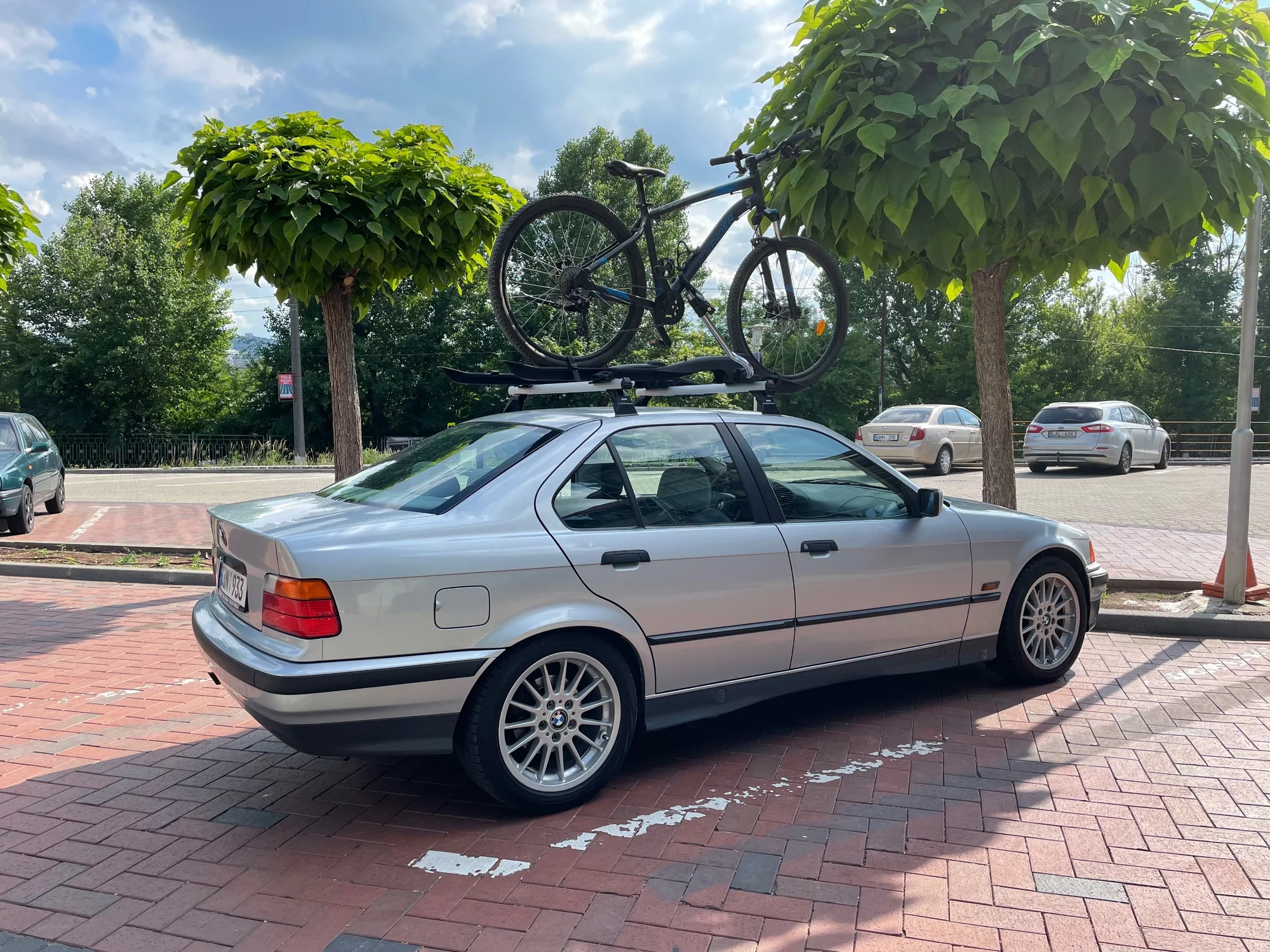 Silver BMW 3-Series with Roof Bike Rack - bmw, e36, sedan, silver-metallic, youngtimer, 3-series