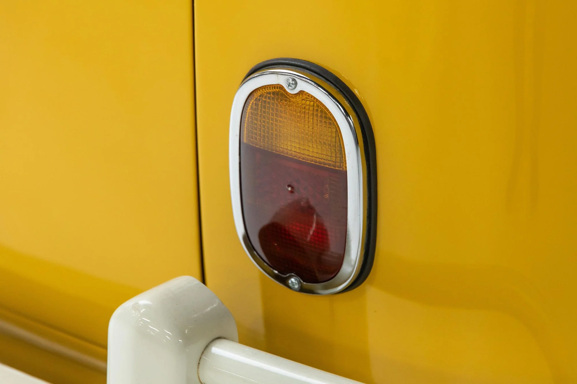 Vintage Yellow Car Tail Light Detail - vintage car, classic automobile, tail light, rear light, oval lens, classic car, vintage