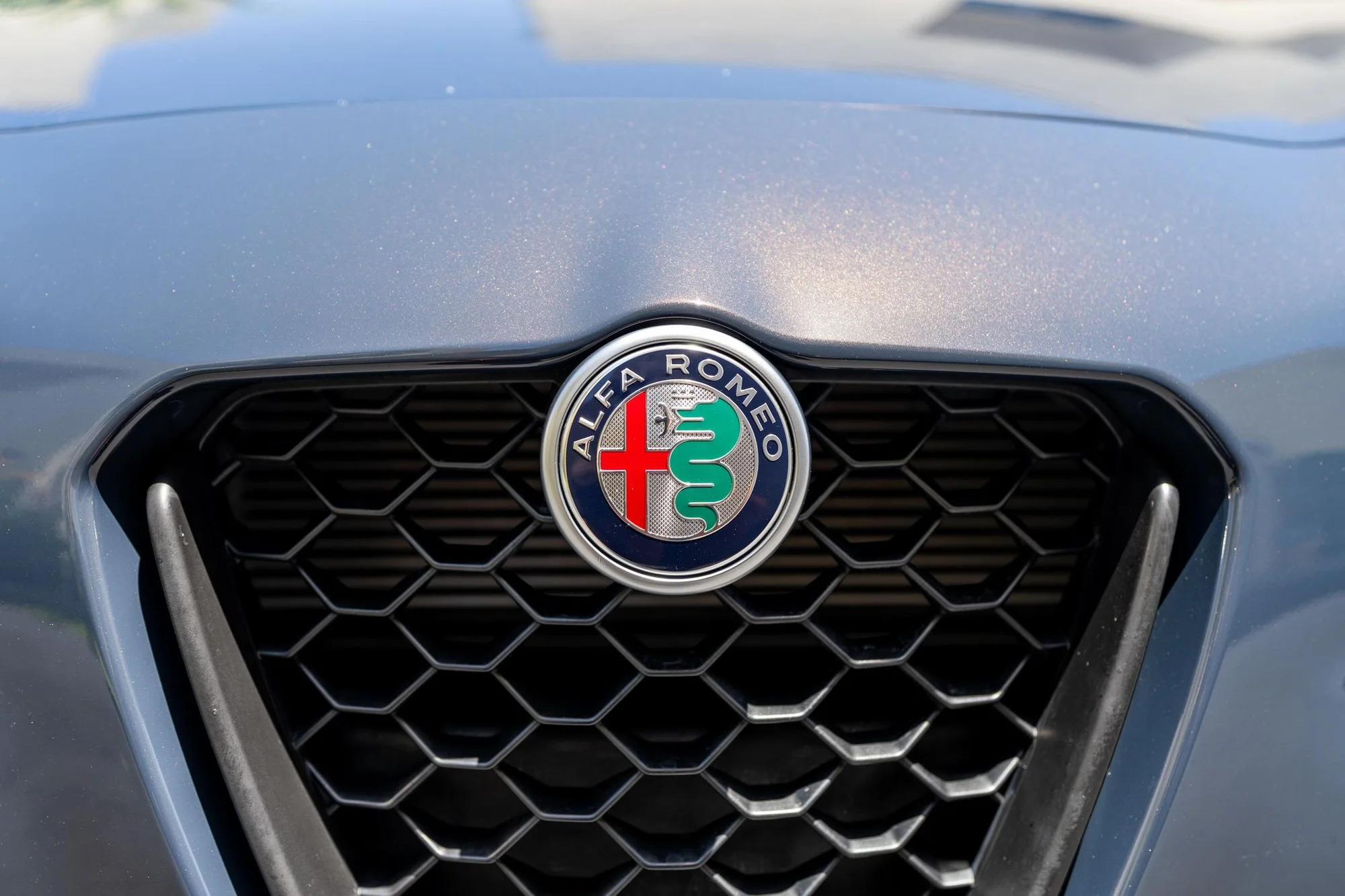 Alfa Romeo Front Grille Detail Shot - alfa-romeo, front-grille, hexagonal-mesh, badge, emblem, grille