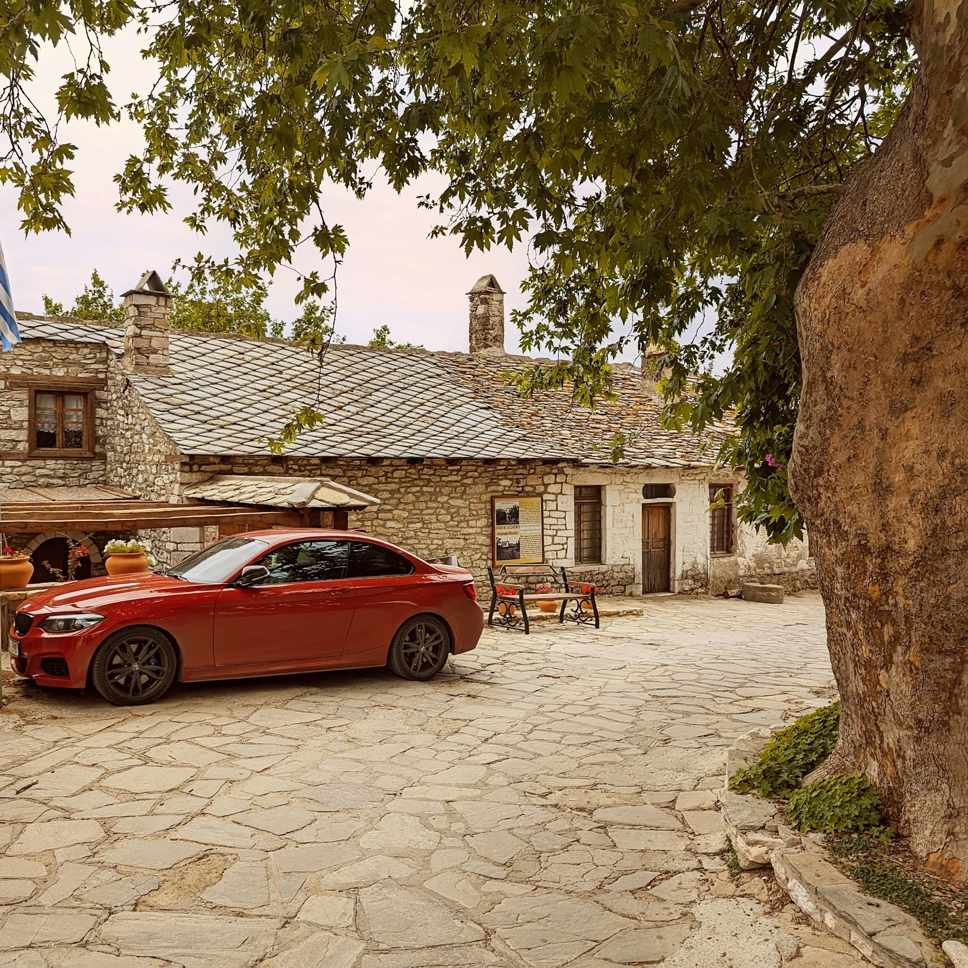 Red BMW Coupe in Historic Stone Courtyard - bmw, coupe, red, sedan, sport